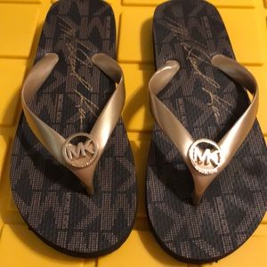 Michael Kors gold logo flip flop. Size 6